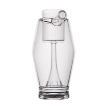 The MJ Arsenal Proxy Bubbler is a clear borosilicate glass pitcher with an inverted wine glass-shaped interior and a top spout—ideal as a stylish dabbing accessory or for showcasing your Proxy Bubbler.