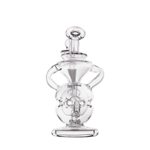 The MJ Arsenal Infinity Mini Dab Rig, made from clear borosilicate glass, features a rounded base, two side handles, and a cylindrical neck, shown against a plain white background.