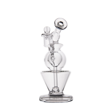 The MJ Arsenal Gemini Mini Dab Rig, made of clear borosilicate glass with a round chamber, angled mouthpiece, and sturdy wide base, is shown against a white background—ideal for portable, on-the-go dabbing.