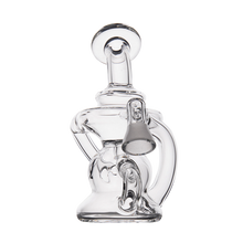 The MJ Arsenal Hydra Vape Edition is a clear mini dab rig with intricate curves and chambers, designed for splash resistance and shown against a plain white background.