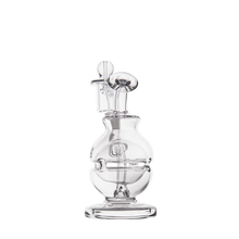 The MJ Arsenal Royale Mini Dab Rig, made of clear borosilicate glass, has a round chamber, vertical mouthpiece, and a horizontal fab egg percolator inside, shown against a plain white background.
