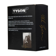 The Tyson Upper Cut Bubbler pairs perfectly with the Black Tyson 2.0 cannabis product box, which features a gold Mike Tyson signature, his black-and-white smoking photo, and white text showcasing the brand's legacy.