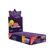 A purple box of Juicy Jay's Flavored Papers, 1 1/4 size, in Blackberry Brandy flavor with triple-dipped taste. Multiple packs are stacked inside, and the open display shows vibrant branded graphics on the lid.