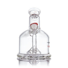 The MJ Arsenal x Tyson 2.0 Punch-Out is a clear borosilicate glass bubbler with a wide cylindrical base, short neck, side carb hole, and curved downstem. Its transparent glass catches subtle light reflections.