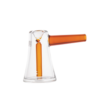 The MJ Arsenal Vulkan Bubbler features a clear borosilicate glass body with a conical base and a striking orange cylindrical handle, designed in a modern minimalist style. Shown against a plain white background.