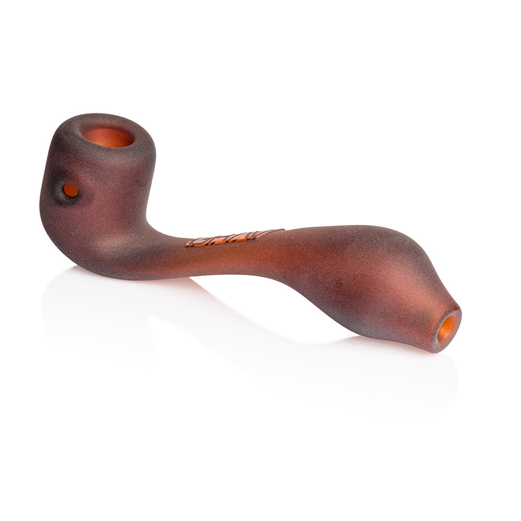 The Grav Sandblasted Classic Sherlock is a brown, curved borosilicate glass hand pipe with a matte finish, featuring a bowl on one end and a mouthpiece on the other, shown against a white background.