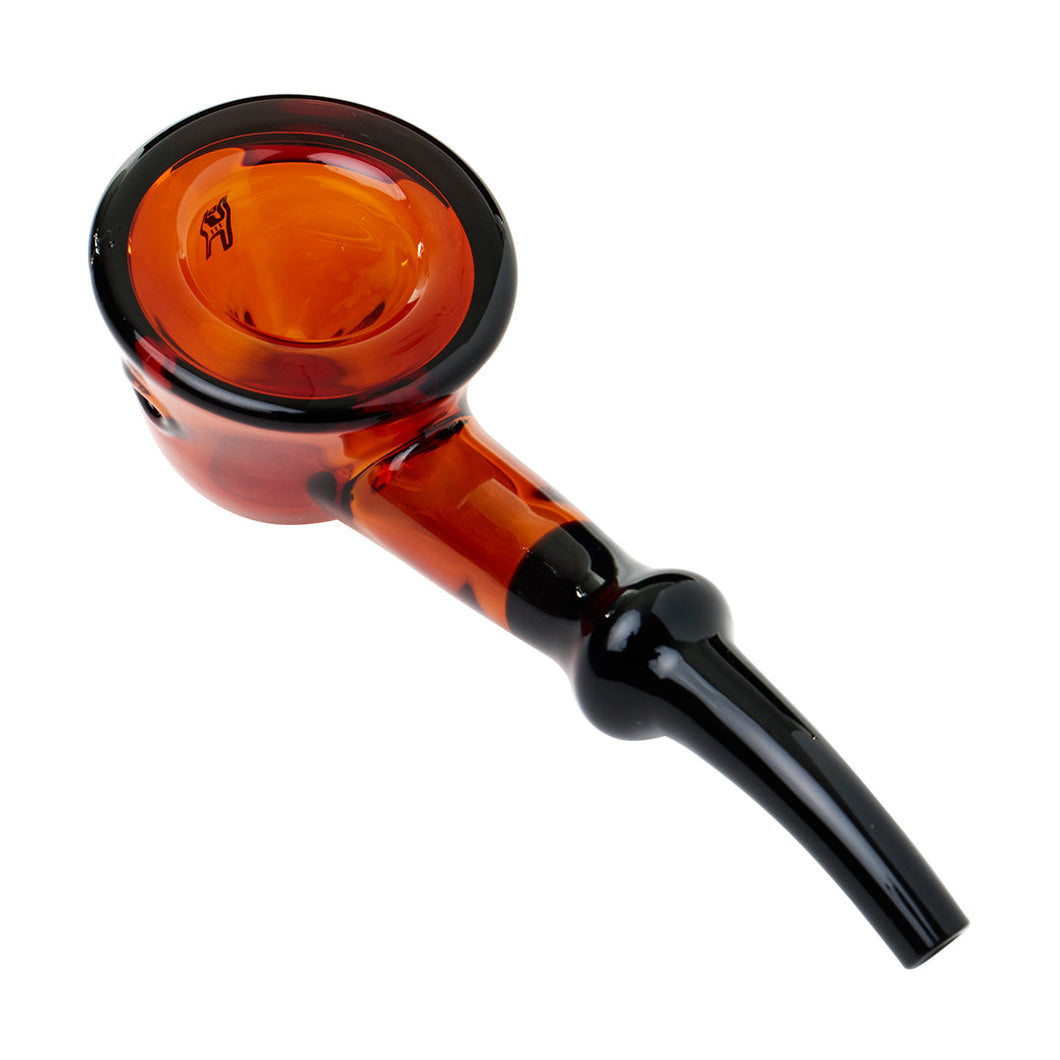 The Human Grade Fleur Hand Pipe is a borosilicate glass hand pipe with a round, deep orange bowl and a black stem, shown from above at an angle on a white background.