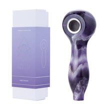 A polished amethyst Gemstone Spoon Pipe with a rounded bowl sits beside its purple and white Astral Project box labeled "Gemstone Spoon Pipe"—an ideal choice for those who appreciate healing gemstones.