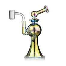 The MJ Arsenal Apollo Mini Dab Rig is a colorful, iridescent piece made from borosilicate glass with a round chamber, angled neck, and clear quartz banger for optimal flavor, shown on a white background.