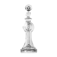 The MJ Arsenal Apollo Mini Dab Rig, made from clear borosilicate glass with smooth, rounded contours and queen-like detailing, stands upright against a white background—perfect for flavor preservation.