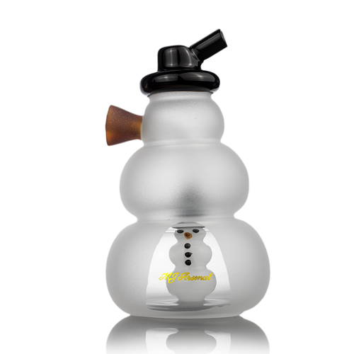 The MJ Arsenal Snowperson Blunt Bubbler is a compact borosilicate glass water pipe with a frosted finish, black mouthpiece, brown side piece, inner snowman figure, and 