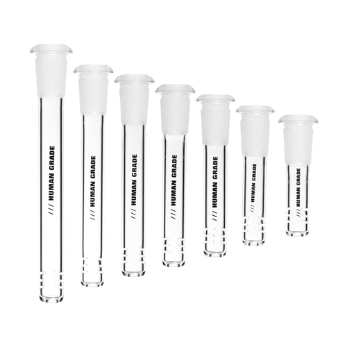 Seven clear Human Grade Downstems of different heights, each fitted with a white stopper and labeled 