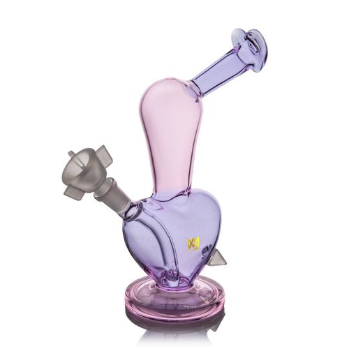 The MJ Arsenal Burning Heart (Valentine's 2024) is a limited-edition, uniquely shaped borosilicate water pipe in translucent pink and purple with a wide base, angled neck, and gray bowl—ideal for collectors.