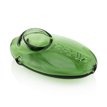 The Grav Pebble Spoon is a green, oval hand pipe with an embossed logo, rounded mouthpiece, and glossy finish—compact and discreet for easy portability and use.