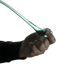 A hand holds the Grav Gandalf glass pipe, featuring a long mouthpiece and bowl at one end, set against a white background.