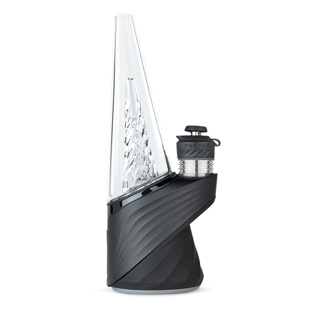 A sleek, modern Puffco New Peak Pro with a clear glass cone-shaped top, textured black base, and attached 3D XL Chamber for advanced dabbing.