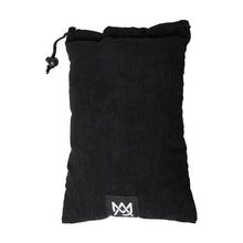 The MJ Arsenal Padded Drawstring Pouch is black with textured fabric, perfect for storing glass accessories, and features a small rectangular label with a white stylized logo near the bottom center.