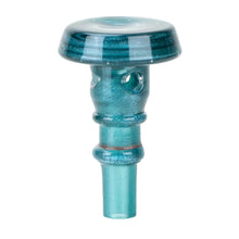 The Empire Glassworks Peak Pro 3DXL Joystick Cap, shown upright on a white background, is made of teal borosilicate glass with a wide, flat top, narrow base, two side holes, and a metallic sheen.