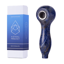 A blue Gemstone Spoon Pipe with a metal bowl sits next to its upright Astral Project - Blue Sodalite box, featuring geometric designs and a product illustration that highlights the allure of healing gemstones.