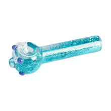 The Red Eye Glass 4.5" Sparkle Liquid Glass Pipe is a glittering turquoise hand pipe with a round bowl and small blue knobs on the side, made of glass and displayed against a white background.