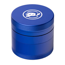 The BIGFUN! Medium Grinder is a cylindrical, metallic blue aluminum grinder with textured grip bands and a white "BO" logo on the lid, offering efficient pollen sifting for great results.