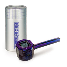 A shiny, purple Red Eye Tek 4.5" Infinity Bowl (Octagon) hand pipe sits in front of a tall, cylindrical silver container with a grid pattern and "REDEYE" printed vertically in bold letters.