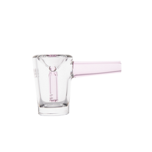 The MJ Arsenal Basin Bubbler features a clear borosilicate glass cup with a cylindrical body and a short, thick, pale pink handle. Its modern design is perfect for showcasing your mini bubbler or water filtration setup.