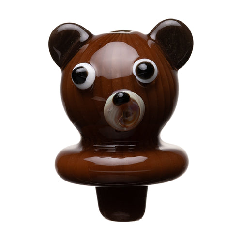 The Human Grade Bear Carb Cap is a small, glossy brown accessory shaped like a bear’s head with exaggerated eyes and ears, crafted from glass or ceramic, and resembles a 510 vape battery with Type-C charging. Shown isolated on a white background.