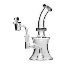 The Human Grade 8" Oil Can Rig is a clear borosilicate glass water pipe with a bent neck, wide base, and attached bowl piece, ideal for smoking or vaporizing. It’s photographed against a white background.