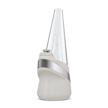 The New Peak Vaporizer features a modern white base, silver accent, and tall clear cone-shaped top, displayed against a plain white background.