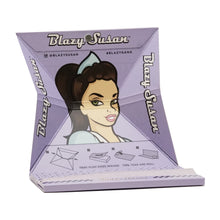 The Blazy Susan Purple Rolling Papers pair perfectly with a purple rolling tray featuring an illustrated woman, the logo, and folding tips—ideal for organizing your deluxe rolling kit or matching your favorite purple papers.