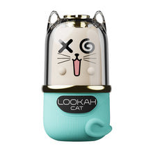 The Lookah Cat Vaporizer 510 Thread Battery is a turquoise and gold capsule-shaped device featuring a cat face with X and spiral eyes, whiskers, nose, pink mouth, a curled tail on the base, and an 800mAh variable power battery.