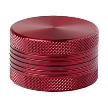 The 2 Piece Flat Grinder is a red, cylindrical metal grinder with a knurled, grooved surface, available in multiple colors and sizes, shown isolated on a white background.