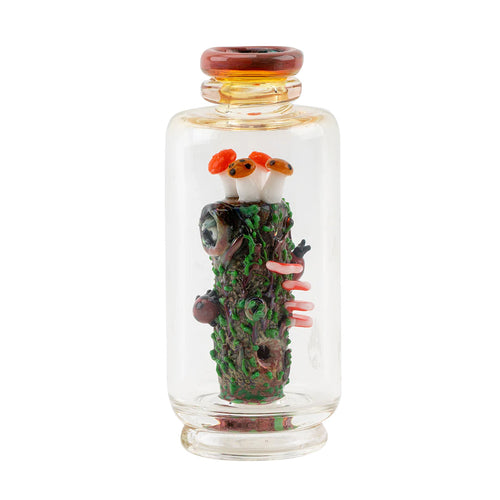 The Empire Glass Works Renew the Redwood Peak Top features a clear borosilicate glass vial containing a detailed miniature forest sculpture with a mossy log, mushrooms, an eyeball, worms, and insects, sealed with a matching glass lid.