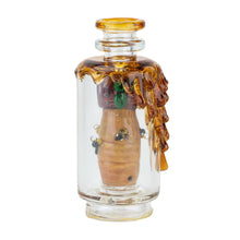 The Empire Glass Works Save the Bees Peak Top is a handcrafted borosilicate glass piece featuring amber honey-like drips, sculpted bees, and a honeycomb inside—an exquisite decorative art piece perfect for display.