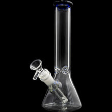 The Glassic Beaker Bong with Color Lip is a clear glass, 10" beaker-style bong featuring a blue-rimmed lip, cylindrical neck, and an angled downstem and bowl near the base, shown against a black background.