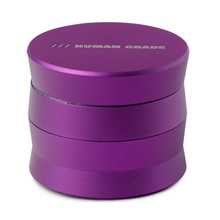 A small, metallic purple, matte-finish aluminum Human Grade Grinder 3A (2" 4-Piece) with a cylindrical shape, slightly curved middle, and "HUMAN GRADE" labeled on top.