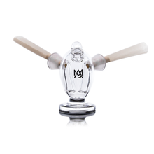 The MJ Arsenal Dubbler Original Double Bubbler is a clear borosilicate glass holder shaped like a standing gorilla with an M logo, holding two joints or blunts—one in each arm. Displayed on a white background.
