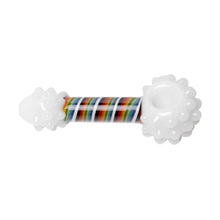 The Human Grade Rainbow Spoon Pipe is a handmade borosilicate glass spoon with rounded, textured ends and a vibrant rainbow-striped stem at the center.