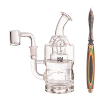 The MJ Arsenal Wooden Round Dab Tool with a colorful handle and pointed tip is shown next to a clear glass dab rig with a side arm and mouthpiece, both set against a white background—ideal for concentrate sessions.