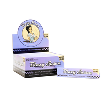 A display box and pack of Blazy Susan Purple Rolling Papers, king size slim. Features: cartoon woman with bun, checkered border, 50 pack, Slow Burning · Ultra-Thin · Vegan.