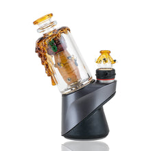 The Empire Glass Works Save the Bees Peak Top is a handcrafted Puffco Peak glass attachment, featuring amber-colored borosilicate drips and marbles, set on a black and gray angled electronic dab rig base.