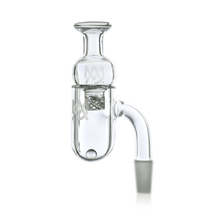 The MJ Arsenal Premium Full Weld Drip Quartz Banger is a clear glass accessory with a full weld quartz build, angled neck, cylindrical chamber, 10mm male joint, and etched designs for airflow, shown on a white background.