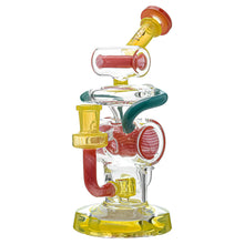 The Calibear Loopsicle Recycler Dab Rig is a colorful borosilicate glass water pipe with yellow, red, and teal accents. It features multiple chambers and tubes on a round base, designed for smooth smoking as a multi-loop recycler.