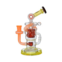 The Calibear Twister Sweet Recycler Dab Rig is a vibrant glass piece with orange and yellow tubing, a round base, and multiple chambers with dual percolator filtration, shown on a white background.