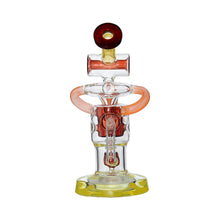 The Calibear Twister Sweet Recycler Dab Rig is a colorful glass piece with a yellow base, transparent and red accents, ergonomic design for comfortable smoking, and unique circular handle-like designs on each side.