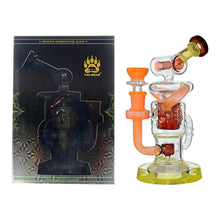 The Calibear Twister Sweet Recycler Dab Rig, with orange, yellow, and clear glass accents, is shown beside its packaging featuring a bear paw logo and the pipe’s silhouette labeled Premium Handcrafted Glass. Its ergonomic design ensures comfort.