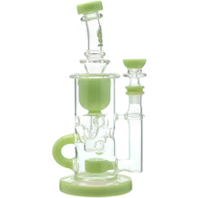 The Calibear Cascade Flower Of Life Klein Recycler Dab Rig is a clear glass pipe with light green accents, a handle, multiple filtration chambers, a Flower of Life percolator, and features a 14mm female joint.