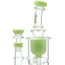 A close-up of the Calibear Cascade Flower Of Life Klein Recycler Dab Rig, a clear glass water pipe with light green accents on the mouthpiece, bowl, and inner chamber. It features a 14mm female joint and a green paw print BEAR logo.