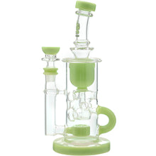 The Calibear Cascade Flower Of Life Klein Recycler Dab Rig is a clear glass rig with light green accents, a cylindrical chamber, side handle, 14mm female joint, and Flower of Life percolator for excellent filtration and stability.